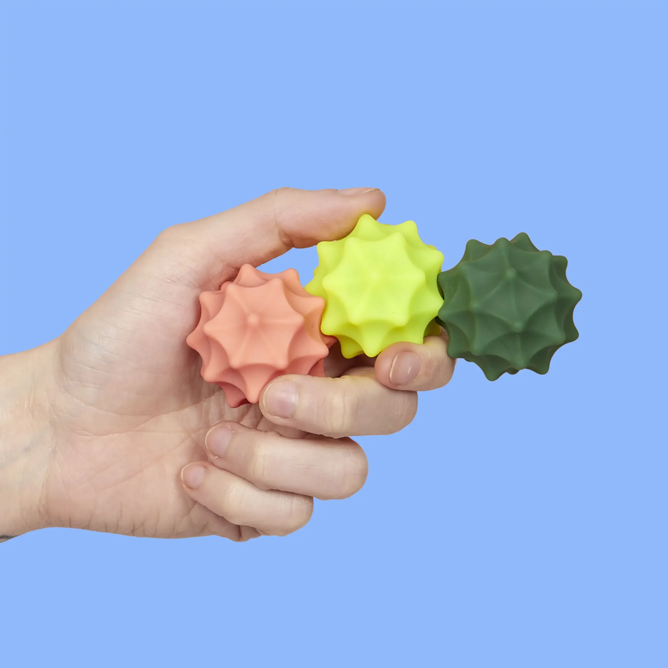 speks-odds-magnetic-fidget-silicone-balls-vivid-spurs-hand (1)